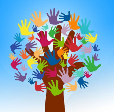 Hands packing food hampers together